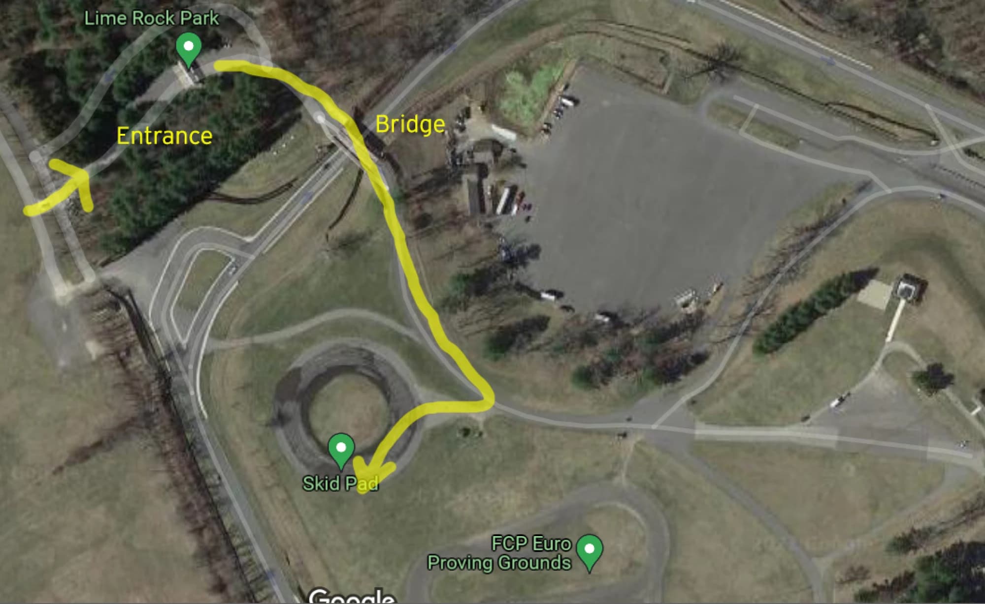 Aerial map of Lime Rock Park with the route marked in yellow: in at the entrance, across the bridge, then down to the skid pad where the pack camps